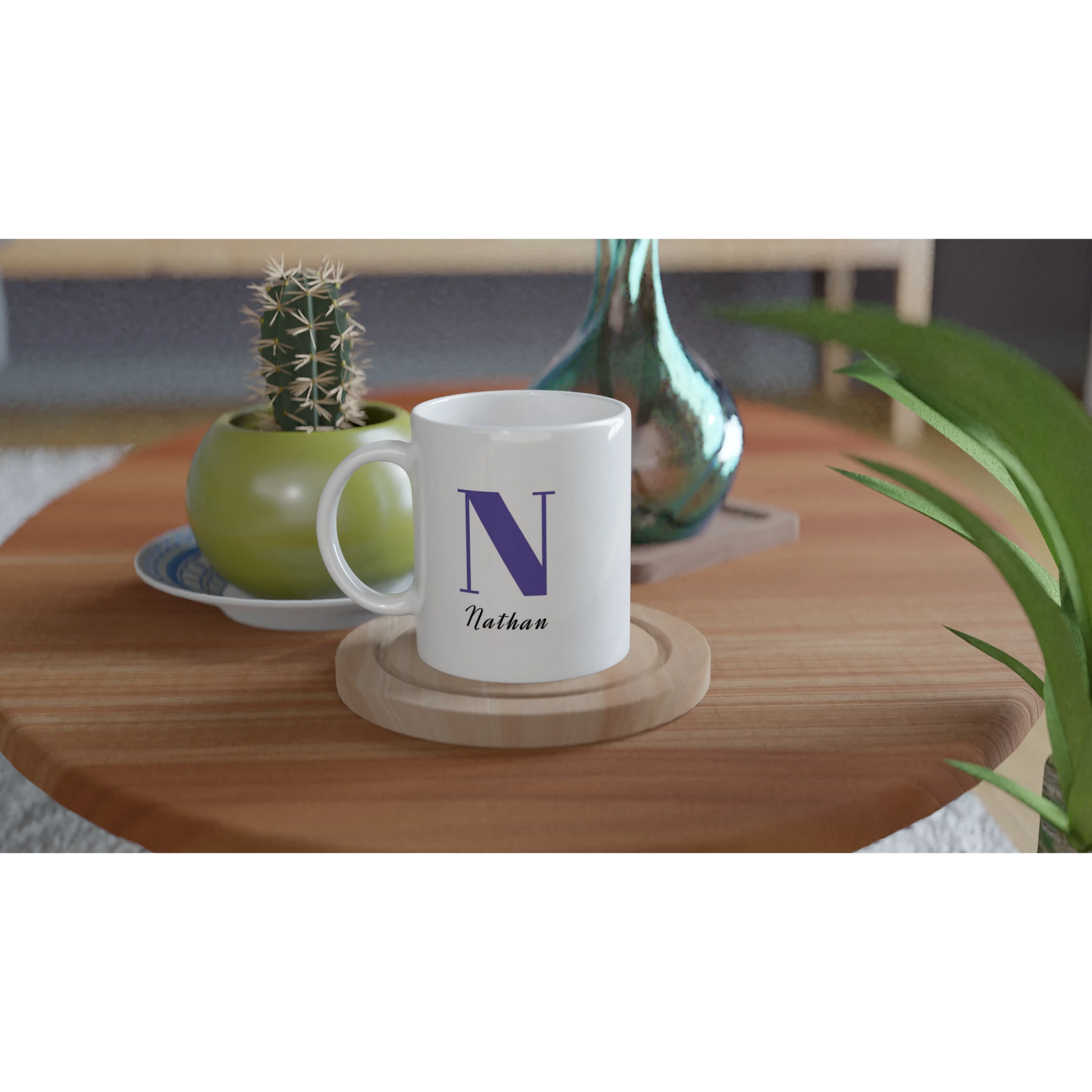 White mug with Blue initial and name