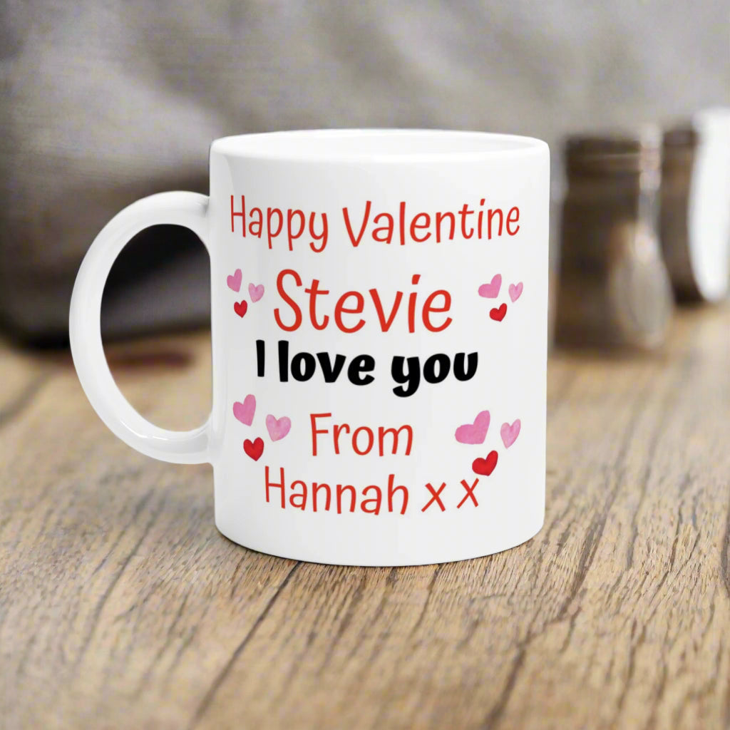 Personalised coffee mug with the text "Happy valentine stevie, I love you from Hannah xx"