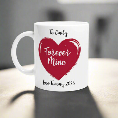 Coffee mug with red heart and text "To Emily forever mine, love Tommy 2025"