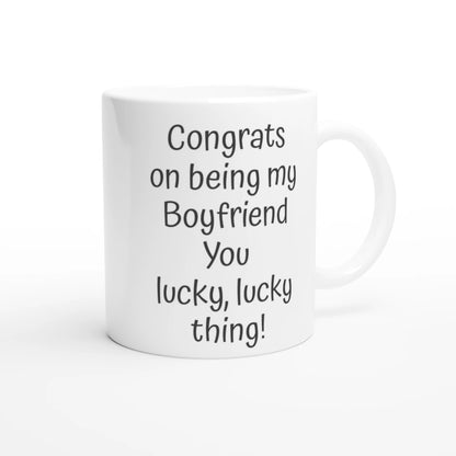 Text on  a Valentines coffee mug, reads "Congrats on being my boyfriend you lcky, lucky thing!"